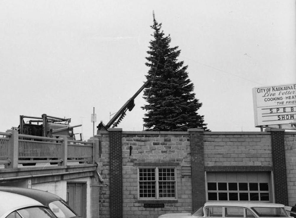 Setting up the city Christmas tree in 1965 on the Lawe Street bridge. Photo posted by Lyle Hansen in the "You know you are from Kaukauna ..." Facebook group.