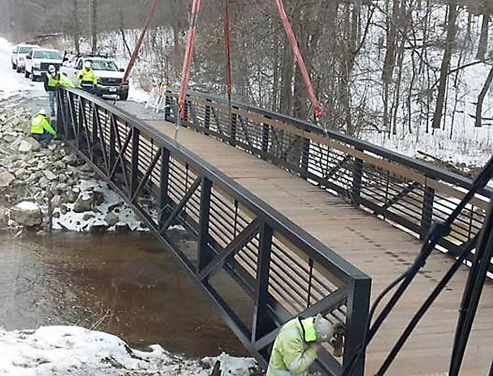 Installation of the new bridge along the Konkapot Trail from the view of crane operator Nathan Van Wychen.