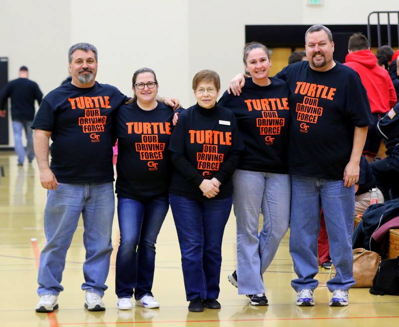 Members of the Lambie family attended Saturday's regional with T-shirts showing support for the longtime bus dri ver. Paul Stumpf photo.