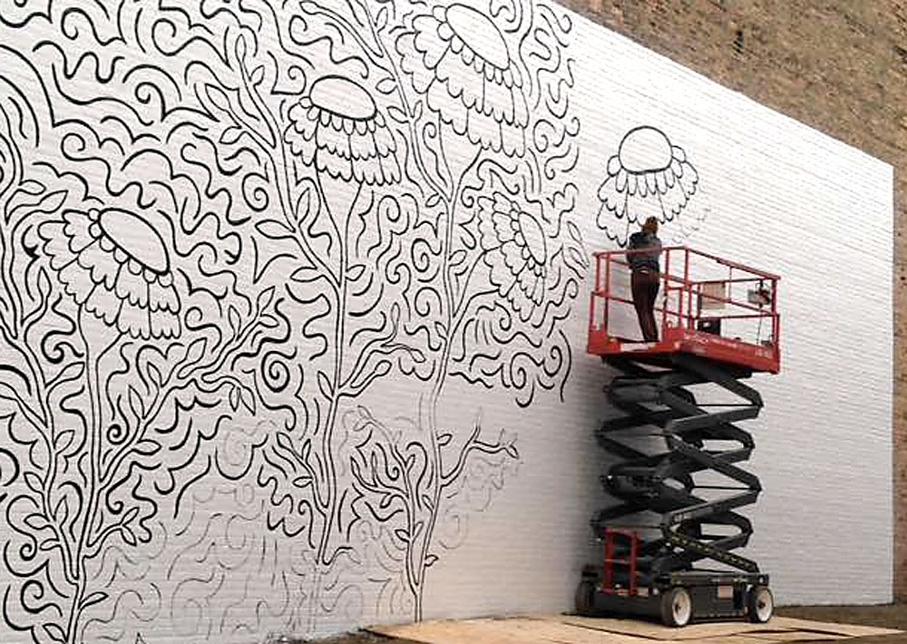 Appleton artist Elyse-Krista Mische begins work on the mural that will be completed April 29, 2017 during Bazaar After Dark. Photo by Tony Penterman.