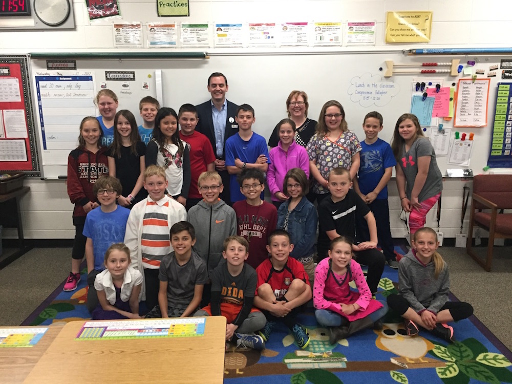 Rep. Mike Gallagher poses for a photo with Mrs. Plutchak's fourth grade class at Electa Quinney Elementary School in Kaukauna. Carrie Forster photo.