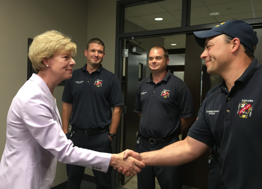 Sen. Tammy Baldwin meets with Kaukauna firefighters May 29, 2018 prior to a roundtable on illegal opioids. 