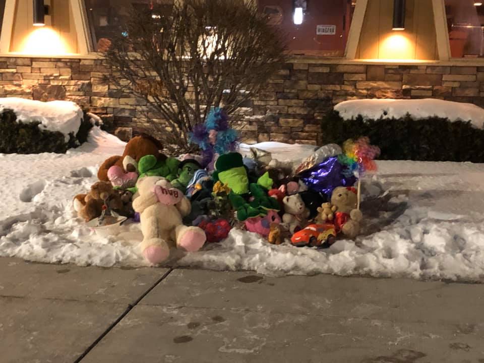 Memorial for Danielle and William Beyer outside of the Kaukauna Pizza Hut. Photo by Jennifer Foust Seefeldt