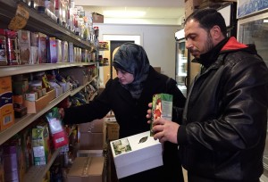 Syrian refugees Rula and Abdul shop at Istanbul Market in Madison, Wis. The couple arrived in Madison on Jan. 20, 2017 with their elementary-age daughters. A week later, President Donald Trump halted any additional arrivals of refugees from the war-torn country indefinitely. They were photographed Jan. 31, 2017. Photo by Dee J. Hall / Wisconsin Center for Investigative Journalism
