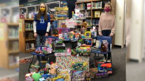 Kyla Laabs and Madisyn Starkey (pictured); Carly Johnson, Ava VanDerSteen, Hayden Anderson and Alyssa Eiting organized the toy drive to benefit Children's Hospital. Kaukuana School District photo.