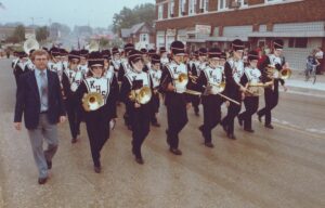 Band director LaVern Lorbiecki leads the Kaukauna High School marching band during the 1984. Memorial Day Parade. Photo by Dan Plutchak.