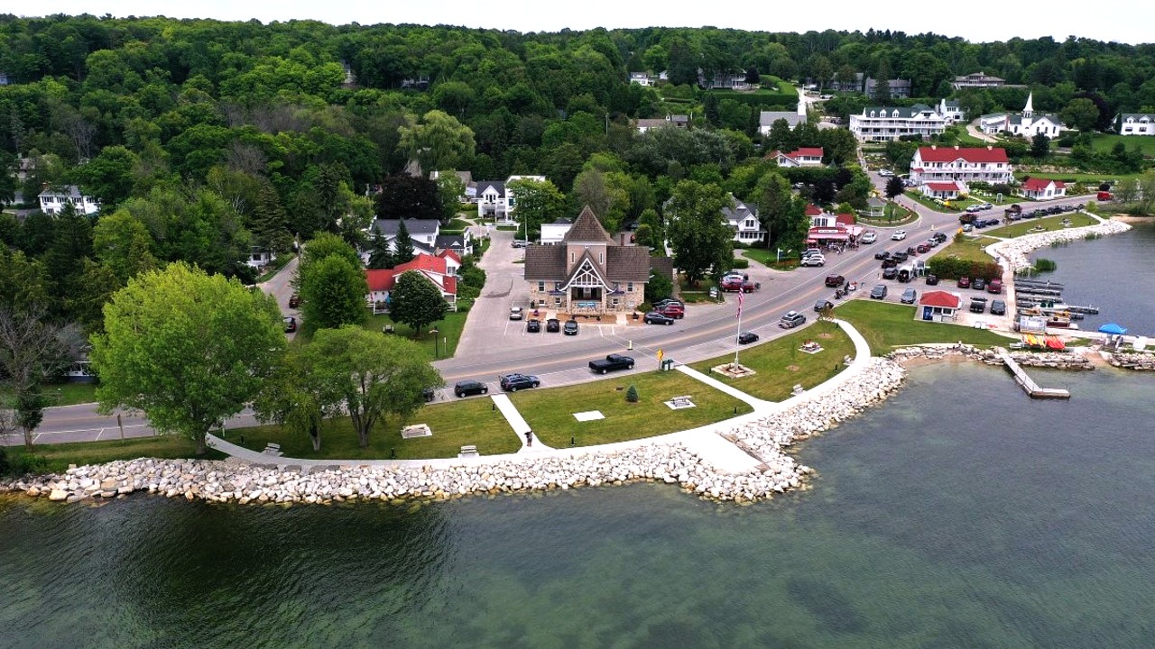 The village of Ephraim, Wis., recently completed a $358,000 project to place large rocks along the shoreline and create a new sidewalk and park space downtown. The rock barriers aim to protect the Lake Michigan shoreline against erosion from powerful waves, which have whittled away land in recent years. Photo taken July 28, 2021. Coburn Dukehart and Tad Dukehart / Wisconsin Watch