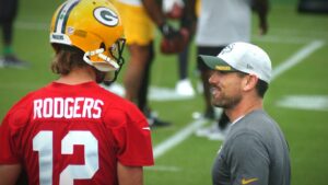Packers' quarterback Aaron Rodgers taoks to Head Coach Matt LaFleur during 2021 training camp in August. Ashwaubenon Community News photo by Dan Plutchak