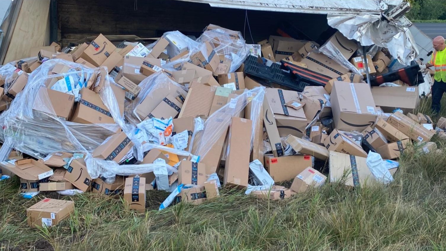 Authorities respond to crash that dumped hundreds of Amazon packages in Wisconsin.