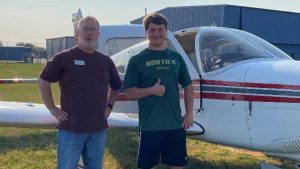 Young Eagle Pilot and Teen Aircraft Build Leader, John Forster (Kaukauna) with build participant Josh Grindle (Oshkosh).