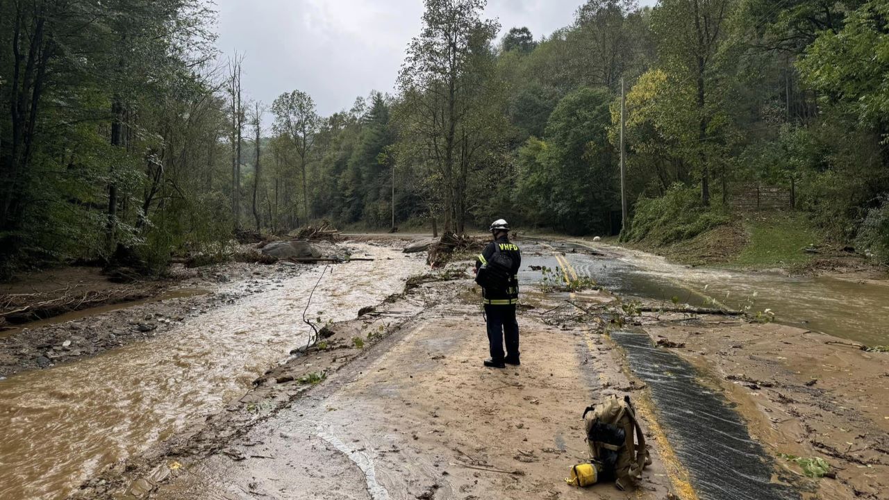 A member of the Vestivia Hills, North Carolina, Fire Department stands by a washed-out road in North Carolina following Hurricane Helene. A search and rescue team from Wisconsin arrived Saturday in the state to help with search and recovery. Vestivia Hills Fire Department photo