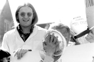 Student government vice president Jim Mallon with Wisconsin Gov. Lee Dreyfus as the governor is about to get a pie in the face during a fundraiser April 6, 1979 on campus.