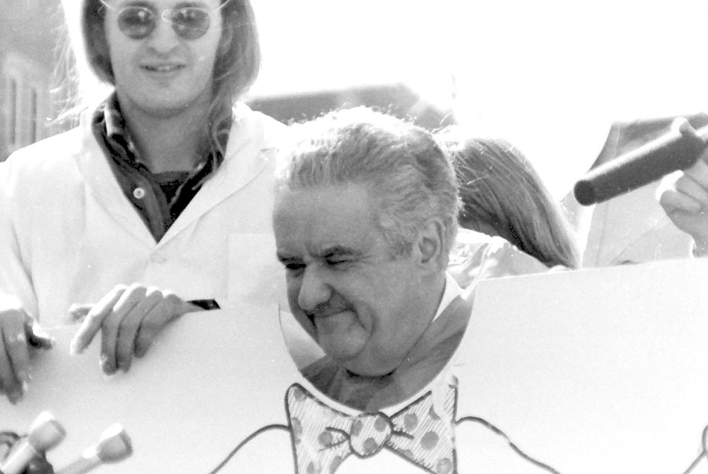 Student government vice president Jim Mallon with Wisconsin Gov. Lee Dreyfus as the governor is about to get a pie in the face during a fundraiser April 6, 1979 on campus.