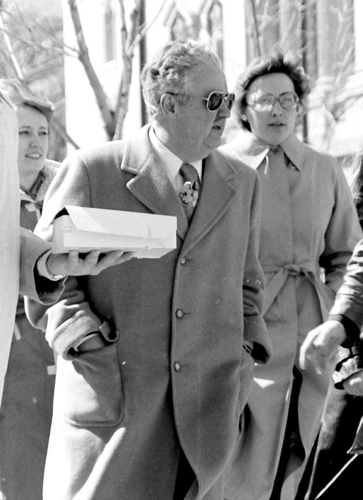 Student government vice president Jim Mallon with Wisconsin Gov. Lee Dreyfus as the governor is about to get a pie in the face during a fundraiser April 6, 1979 on campus.