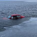 Driver safe; Police working to recover car that crashed through ice in Neenah