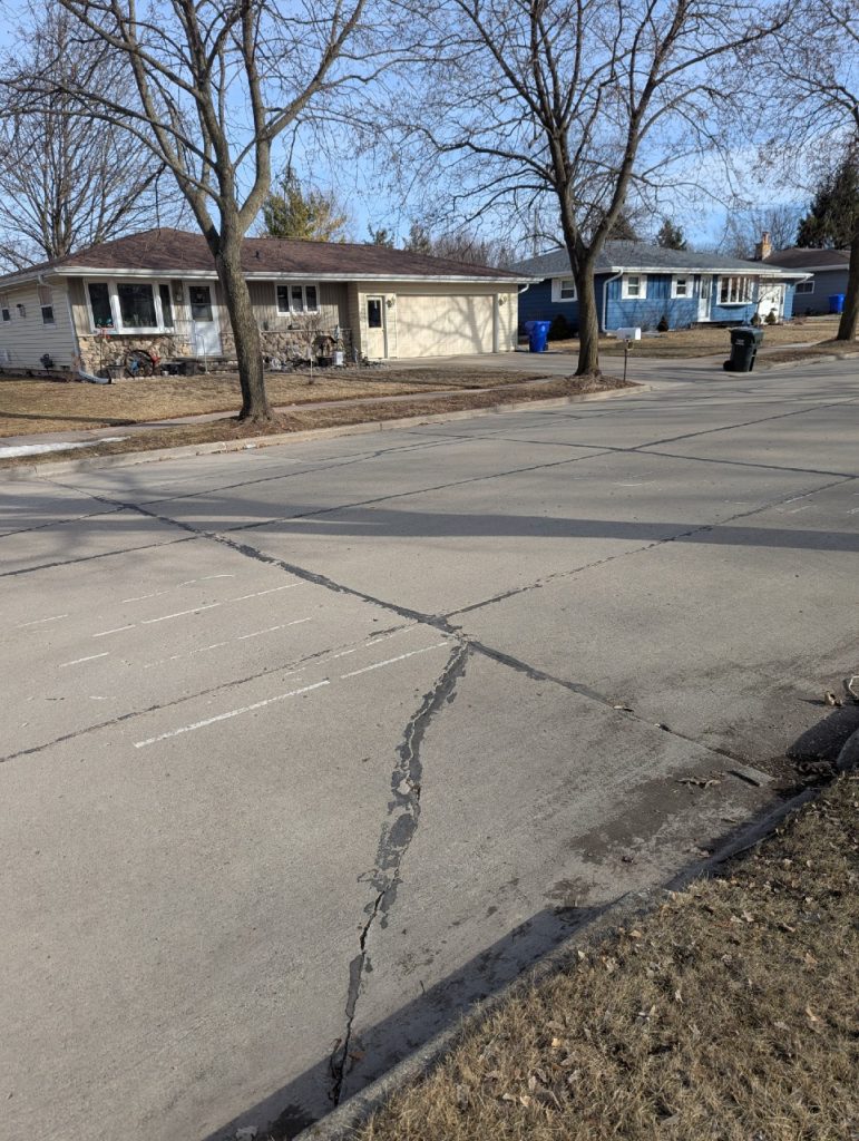 Crosswalk paint on the pavement near Quinney and Tanner is nearly worn off. Photo by Jamie Smithey.