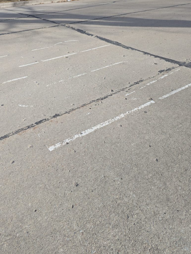 Crosswalk paint on the pavement near Quinney and Tanner is nearly worn off. Photo by Jamie Smithey.