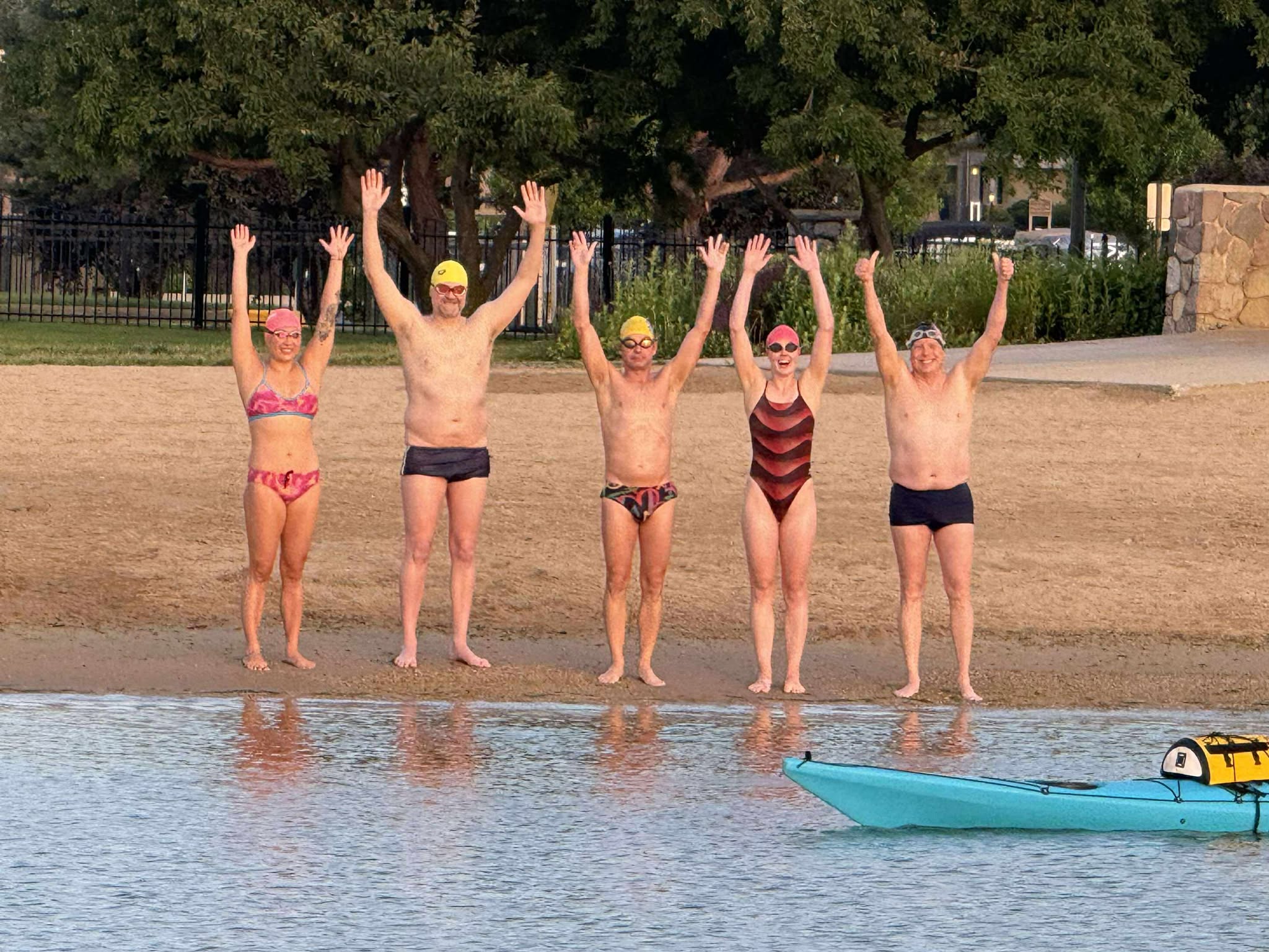 From left to right: Qing Li, David McGlynn, John Fischbach, Ella Morris and Michael Johmann swam the length of Geneva Lake in 4 hours and 15 minutes. Photos courtesy of Michael Johmann