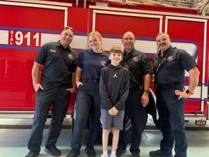 Kaukauna boy who collapsed on playground returns to thank first responders who saved his life