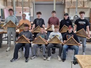 Kaukauna High student woodworkers create flag cases to honor those who served